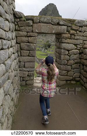 Girl photographing at The Lost City of The Incas, Machu Picchu, Cusco Region, Peru View Large Photo Image Stock Image - Girl photographing at The Lost City of The Incas, Machu Picchu, Cusco Region, Peru. Fotosearch