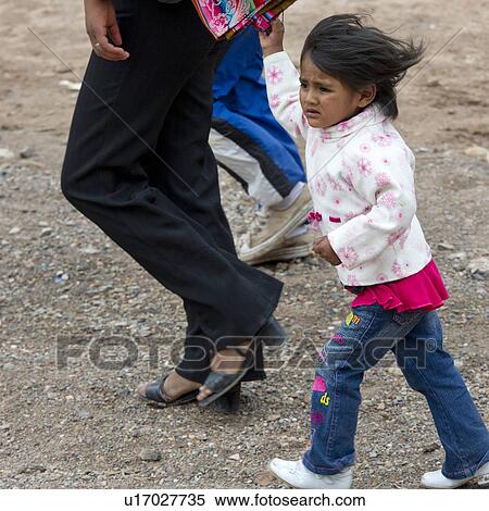 Girl walking with her parents, Sacred Valley, Cusco Region, Peru View Large Photo Image Stock Photography - Girl walking with her parents, Sacred Valley, Cusco Region, Peru. Fotosearch