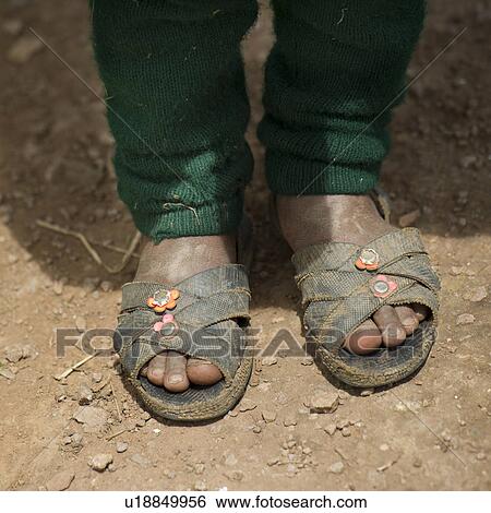 Stock Photograph - Girl's feet in sandals, Chumpepoke Primary School, Sacred Valley, Cusco Region, Peru. Fotosearch