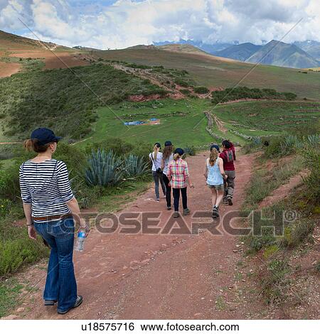 Group of people walking towards Incan agricultural terraces, Moray, Machu Picchu, Cusco Region, Peru View Large Photo Image Stock Photograph - Group of people walking towards Incan agricultural terraces, Moray, Machu Picchu, Cusco Region, Peru. Fotosearch