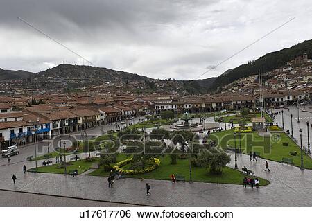Stock Photograph - High angle view tourists at Plaza de Armas, Cuzco, Peru. Fotosearch