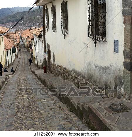 Stock Photo - Houses along an alley, Sacred Valley, Machu Picchu, Cuzco, Peru. Fotosearch