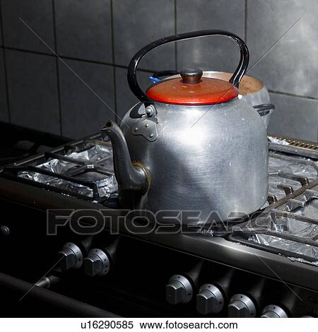 Stock Photography - Kettle on a gas stove burner in a kitchen of a guesthouse, Willka Tika, Sacred Valley, Cusco Region, Peru. Fotosearch