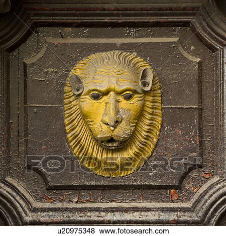 Stock Photo - Lion's face carved on a door, Cuzco, Peru. Fotosearch