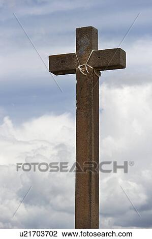 Stock Image - Low angle view of a wooden cross, Maras, Sacred Valley, Cusco Region, Peru. Fotosearch