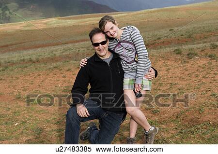 Man arm around her daughter and smiling, Sacred Valley, Cusco Region, Peru View Large Photo Image Stock Photography - Man arm around her daughter and smiling, Sacred Valley, Cusco Region, Peru. Fotosearch