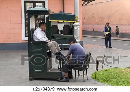 Man having shoes polished in shoe polish booth, Historic Centre of Lima, Lima, Peru View Large Photo Image Stock Photo - Man having shoes polished in shoe polish booth, Historic Centre of Lima, Lima, Peru. Fotosearch