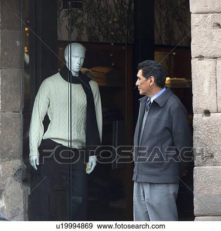 Man looking at the mannequin in the display window of clothing store, Cuzco, Peru View Large Photo Image Stock Photo - Man looking at the mannequin in the display window of clothing store, Cuzco, Peru. Fotosearch