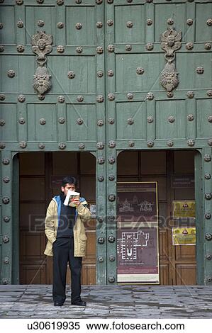 Man reading a book in front of a store, Plaza de Armas, Cuzco, Peru View Large Photo Image Stock Photography - Man reading a book in front of a store, Plaza de Armas, Cuzco, Peru. Fotosearch