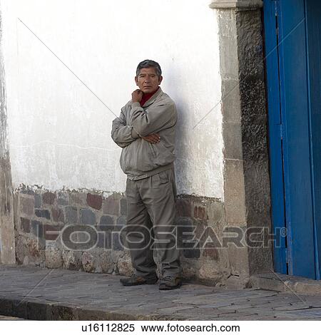 Man standing outside a house, Barrio de San Blas, Cuzco, Peru View Large Photo Image Stock Photography - Man standing outside a house, Barrio de San Blas, Cuzco, Peru. Fotosearch