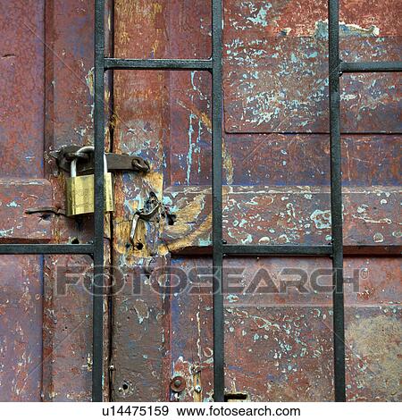Stock Photo - Padlock on a closed door, Cuzco, Peru. Fotosearch