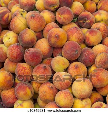 Stock Image - Peaches for sale at a store, Sacred Valley, Cusco Region, Peru. Fotosearch