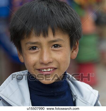 Stock Image - Portrait of a boy smiling, Cuzco, Peru. Fotosearch