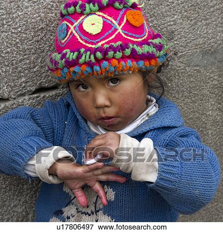 Portrait of a girl cleaning her fingers, Cuzco, Peru View Large Photo Image Stock Photo - Portrait of a girl cleaning her fingers, Cuzco, Peru. Fotosearch