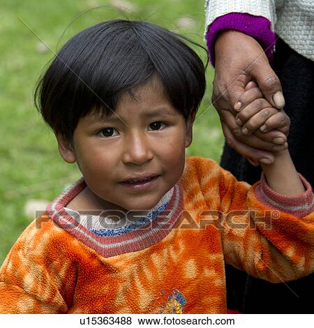 Portrait of a girl holding her mother's hand, Sacred Valley, Cusco Region, Peru View Large Photo Image Stock Photo - Portrait of a girl holding her mother's hand, Sacred Valley, Cusco Region, Peru. Fotosearch