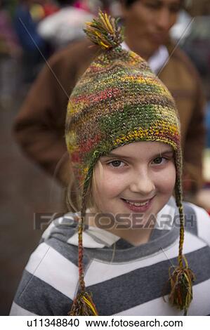 Portrait of a girl wearing a bobble hat, Plaza Regocijo, Cuzco, Peru View Large Photo Image Stock Image - Portrait of a girl wearing a bobble hat, Plaza Regocijo, Cuzco, Peru. Fotosearch
