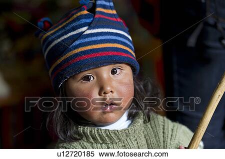 Stock Photography - Portrait of a girl wearing a knit hat, Barrio de San Blas, Cuzco, Peru. Fotosearch