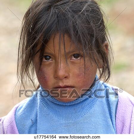 Portrait of a girl with tousled hair, Sacred Valley, Cusco Region, Peru View Large Photo Image Picture - Portrait of a girl with tousled hair, Sacred Valley, Cusco Region, Peru. Fotosearch