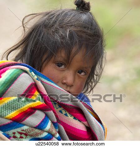 Stock Photo - Portrait of a girl with tousled hair, Sacred Valley, Cusco Region, Peru. Fotosearch