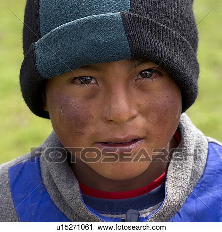 Stock Image - Portrait of a Quechua Indian boy at Chumpepoke Primary School, Poques, Sacred Valley, Cusco Region, Peru. Fotosearch