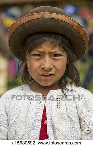 Stock Image - Portrait of a Quechua Indian girl at Chumpepoke Primary School, Poques, Sacred Valley, Cusco Region, Peru. Fotosearch
