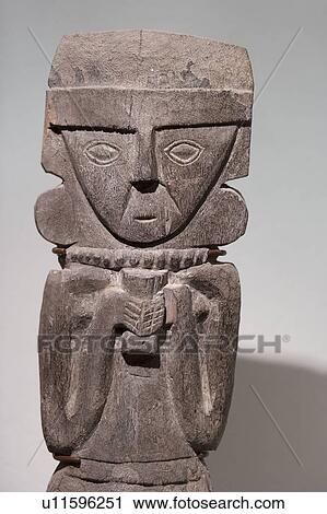Stock Image - Pre-Columbian Wooden statue in Museo de Arte Precolombino, Cuzco, Peru. Fotosearch
