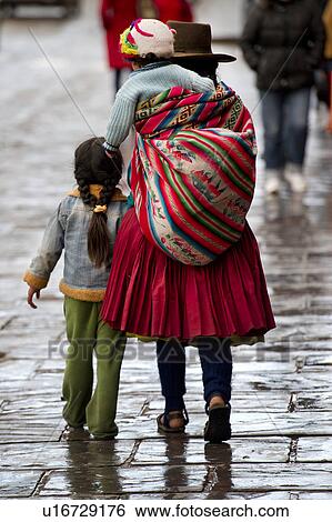 Quechua family walking on the street, Cuzco, Peru View Large Photo Image Stock Photograph - Quechua family walking on the street, Cuzco, Peru. Fotosearch