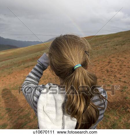 Rear view of a teenage girl looking at mountain view, Sacred Valley, Cusco Region, Peru View Large Photo Image Stock Image - Rear view of a teenage girl looking at mountain view, Sacred Valley, Cusco Region, Peru. Fotosearch