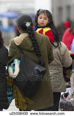 Rear view of a woman carrying her daughter, Cuzco, Peru View Large Photo Image Stock Image - Rear view of a woman carrying her daughter, Cuzco, Peru. Fotosearch
