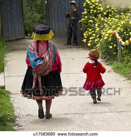 Rear view of a woman with her child, Chumpepoke Primary School, Sacred Valley, Cusco Region, Peru View Large Photo Image Stock Photo - Rear view of a woman with her child, Chumpepoke Primary School, Sacred Valley, Cusco Region, Peru. Fotosearch