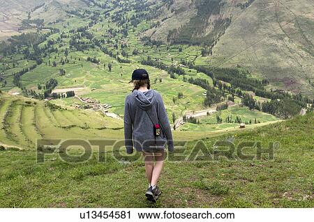 Stock Image - Teenage girl at Archaeological Park of Pisac, Pisac, Sacred Valley, Cusco Region, Peru. Fotosearch