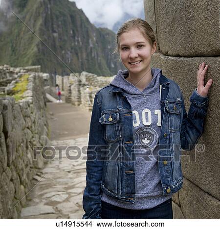 Teenage girl at The Lost City of The Incas, Machu Picchu, Cusco Region, Peru View Large Photo Image Picture - Teenage girl at The Lost City of The Incas, Machu Picchu, Cusco Region, Peru. Fotosearch