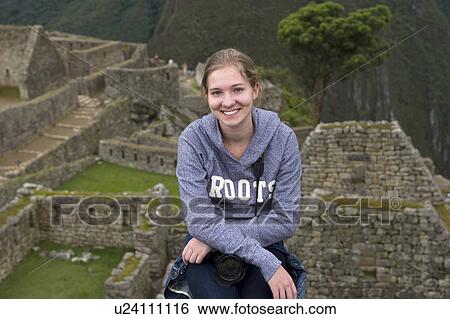 Stock Photograph - Teenage girl at The Lost City of The Incas, Machu Picchu, Cusco Region, Peru. Fotosearch