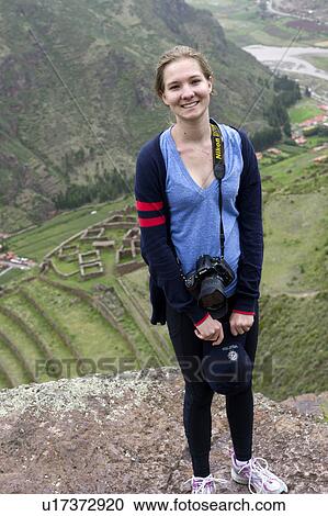 Teenage girl smiling with Archaeological Park of Pisac in the background, Pisac, Sacred Valley, Cusco Region, Peru View Large Photo Image Stock Image - Teenage girl smiling with Archaeological Park of Pisac in the background, Pisac, Sacred Valley, Cusco Region, Peru. Fotosearch