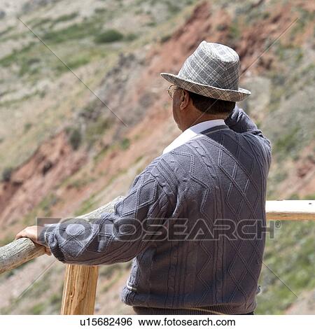 Stock Photograph - Tourist looking at view, Maras, Sacred Valley, Cusco Region, Peru. Fotosearch