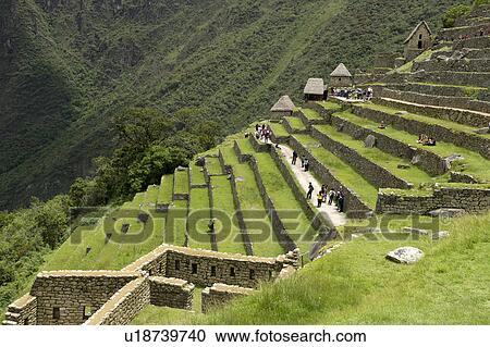 Stock Image - Tourists at The Lost City of The Incas, Machu Picchu, Cusco Region, Peru. Fotosearch
