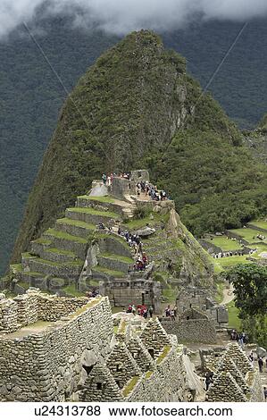 Stock Photo - Tourists at The Lost City of The Incas, Machu Picchu, Cusco Region, Peru. Fotosearch