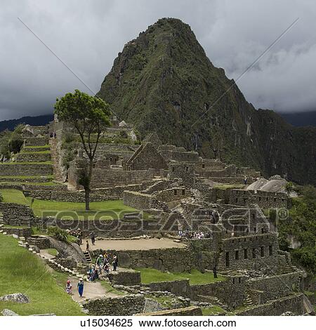Stock Photography - Tourists at The Lost City of The Incas, Machu Picchu, Cusco Region, Peru. Fotosearch