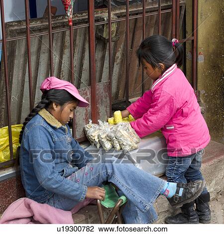 Two girls at a market stall, Sacred Valley, Cusco Region, Peru View Large Photo Image Stock Image - Two girls at a market stall, Sacred Valley, Cusco Region, Peru. Fotosearch