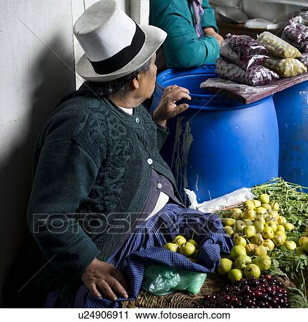 Stock Image - Vendor selling fruits at a market stall, Mercado Central, Cuzco, Peru. Fotosearch