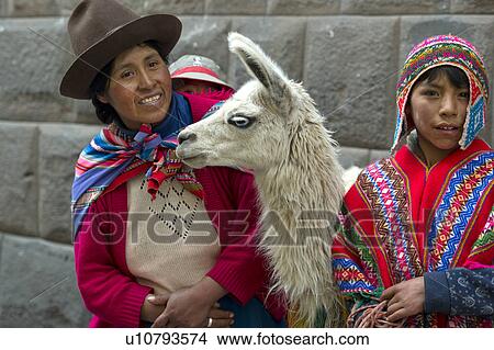 Woman and his son standing with a llama (Lama glama), Sacred Valley, Cusco Region, Peru View Large Photo Image Picture - Woman and his son standing with a llama (Lama glama), Sacred Valley, Cusco Region, Peru. Fotosearch