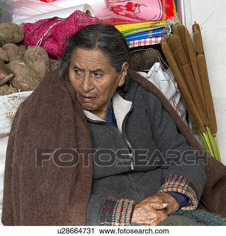 Stock Image - Woman at a market stall, Mercado Central, Cuzco, Peru. Fotosearch