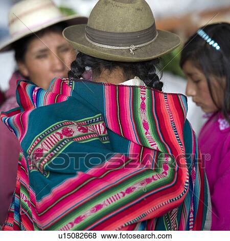 Stock Photo - Woman with girls at Mercado Central, Cuzco, Peru. Fotosearch