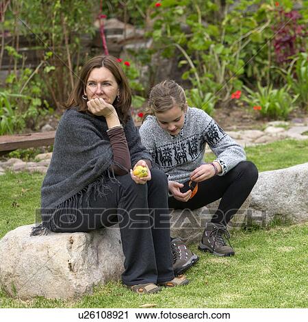 Woman with her daughter sitting in the lawn of Willka Tika Guesthouse, Willka Tika, Sacred Valley, Cusco Region, Peru View Large Photo Image Stock Image - Woman with her daughter sitting in the lawn of Willka Tika Guesthouse, Willka Tika, Sacred Valley, Cusco Region, Peru. Fotosearch