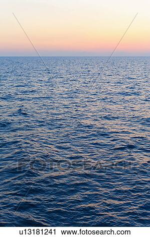 Stock Image - Aegean Sea horizon at sunset. Fotosearch