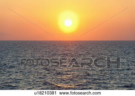 Stock Image - Aegean Sea horizon at sunset. Fotosearch