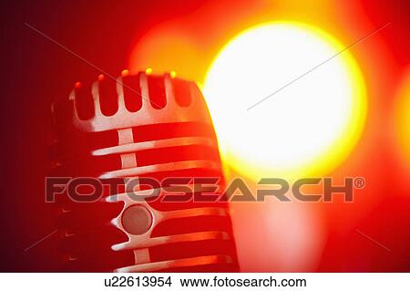 Picture - Antique microphone in spotlight. Fotosearch