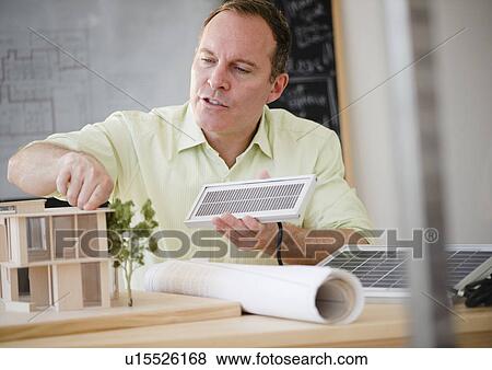 Stock Photo - Architect working in office. Fotosearch