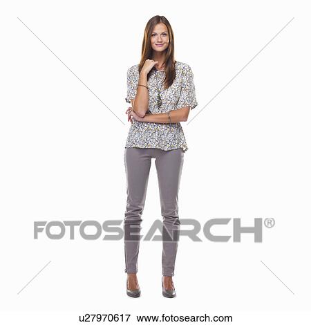 Stock Photo - Attractive young woman standing and smiling. Fotosearch