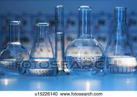 Beakers and flasks with periodic tables in laboratory View Large Photo Image Stock Image - Beakers and flasks with periodic tables in laboratory. Fotosearch